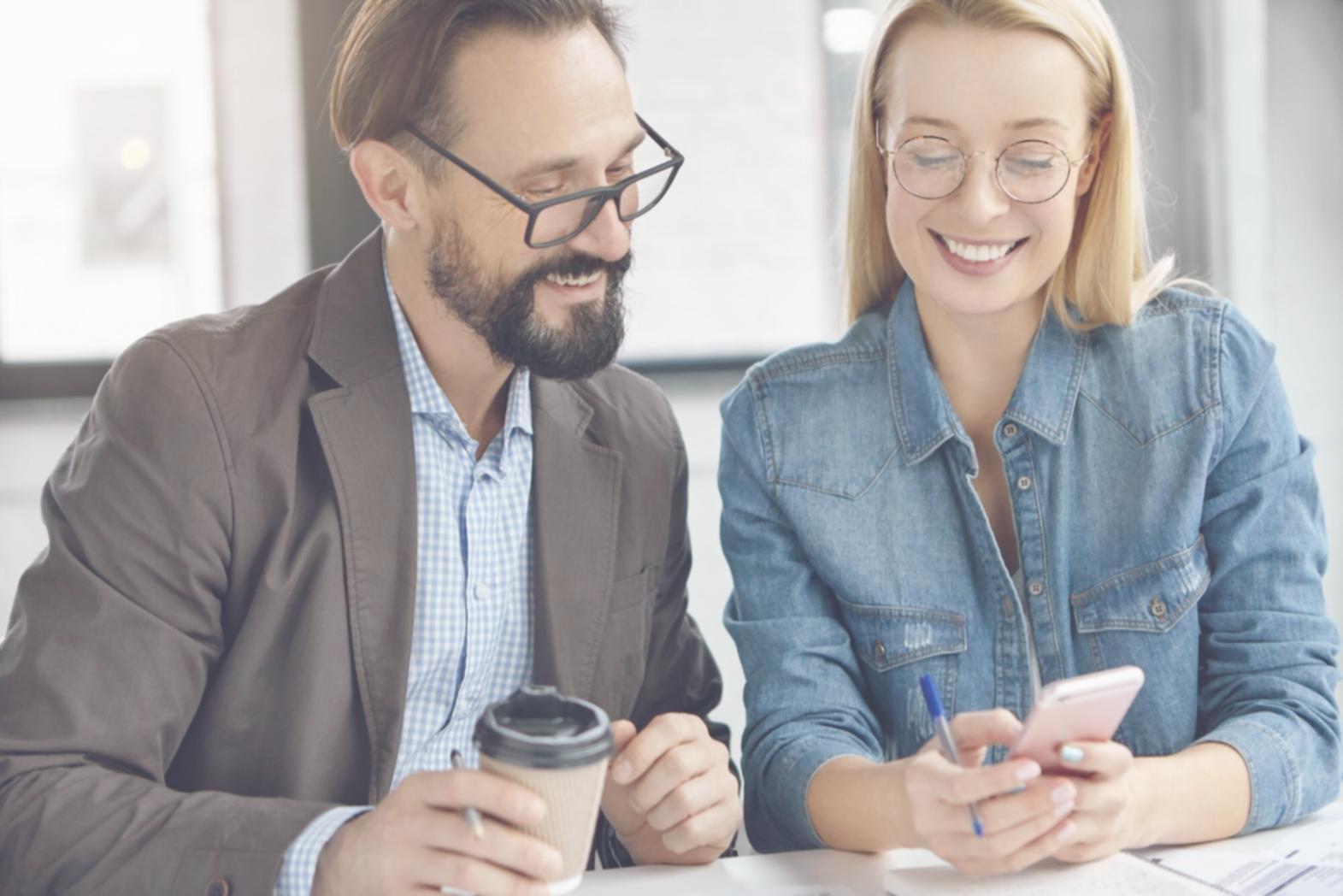 Detailed franchise documents spread across a desk with highlighted sections and notes